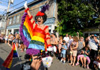 PROVINCETOWN -- 08/18/11-- An elated Miss Richfield whizzes by on a scooter during the Carnival parade. 