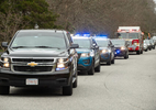 CENTERVILLE - Barnstable community liaison officer Brian Morrison leads a birthday parade of police and fire vehicles as well as friends and family for Coco’s 5th birthday on Monday, April 20, 2020. 