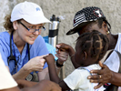Forward in Health trip leader Paula Mulqueen evaluates a toddler at the Adventist Church in Ducis, Haiti on Wednesday, November 2, 2016. 
