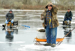  Bob Perry of South Harwich takes a gander at the yellow perch he pulled up a frozen over Mill Pond with his buddies Bill Trombi of East Harwich, left, and Jerry Kissell of Sandwich. {quote}We call these freshwater haddock,{quote} Perry said.