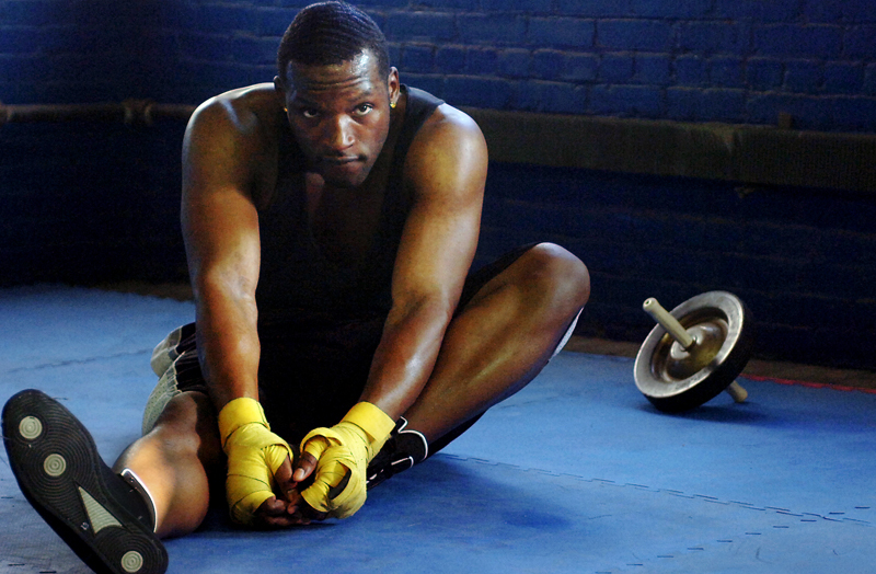 Maurice stretches during his workout at Manfredo's Gym on Thursday, May 3, 2007. {quote}Sometimes I get tired, or I had a bad day.{quote} Maurice Cole said of sticking to his strict schedule even though it can be easy to fall into a habit of making excuses.