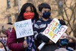 Juliana Winters (left) with her son Oliver Winters, age 5, from Seattle participate in a rally protesting anti-Asian hate crimes called ìKids vs. Racism{quote} at Hing Hay Park in the Chinatown-International District of Seattle, Washington, U.S. on March 20, 2021. (Photo by Karen Ducey).