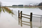 Flooded farmland off 28th Ave NW, a closed road in Norman, Snohomish County, on Wednesday, December 6, 2023. The Stillaguamish River set a preliminary record at 21.34 feet — the highest the river has ever risen — with major flooding in Silvana.