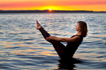Angeline Johnston, yoga instructor and owner of Richmond Beach Yoga, poses at a beach in Edmonds, Wash. on July 31, 2015. (photo © Karen Ducey)