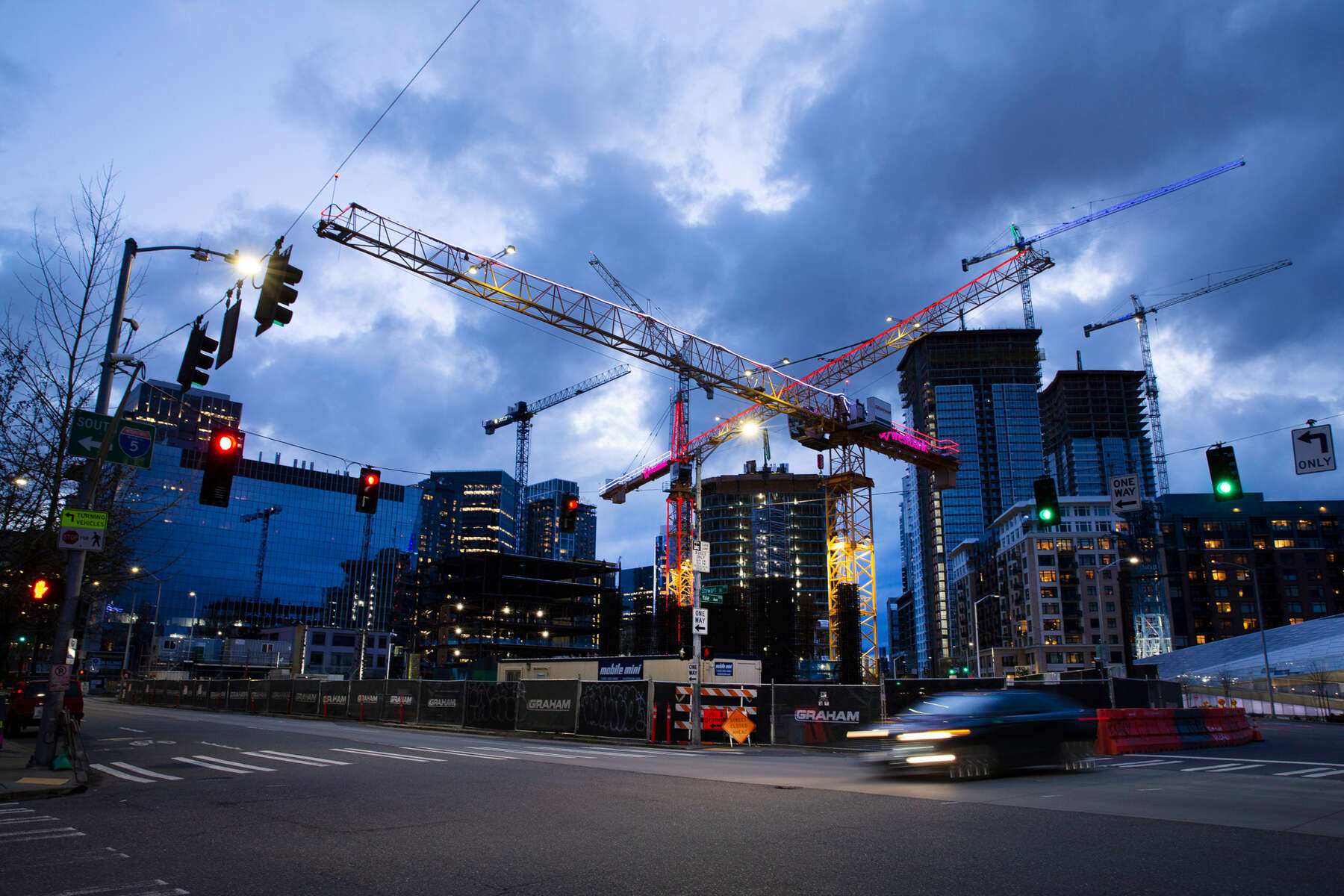 SEATTLE, WA - APRIL 2: Tower cranes crisscross the sky on April 2, 2020 in Seattle, Washington. Most commercial and residential construction sites are considered a nonessential activity and operations have stopped under the state’s new stay-at-home order in an effort to slow the spread of coronavirus (COVID-19). (Photo by Karen Ducey/Getty Images)
