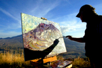 Roderick Smith from Portland, Oregon works on a painting he calls {quote}The Last Tango with Mount St. Helens{quote} outside the Johnston Hill Observatory in Washington on September 30, 2004. Active seismic activity has led scientists to believe the volcano could erupt any day. (© copyright Karen Ducey)