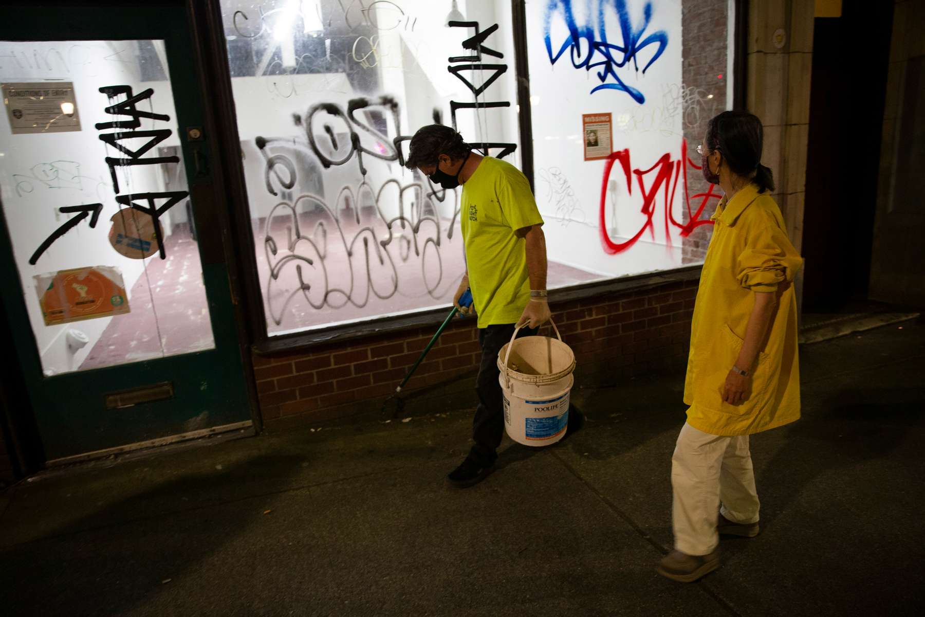 Volunteers of the night watch group in the Chinatown - International District in Seattle, Washington on July 20, 2020. The group numbers between 6 - a dozen volunteers a night who patrol the neighborhood  (Photo by Karen Ducey)