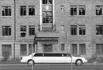 A limousine in town for the Miss USA Beauty Pageant passes by one of Gary's many dilapidated buildings.  In an effort to improve the city 253 buildings were demolished last year. {quote}The city may not have been ready{quote} explains Richard Grey, managing editor of the local paper the Post-Tribune, {quote}but if you wait until you're ready you're never gonna have these things.{quote}  (© Karen Ducey 2001)