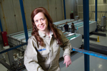 Christina A. Lomasney, CEO of MODUMETAL, Inc, poses in front of the processing line. (© copyright Karen Ducey)