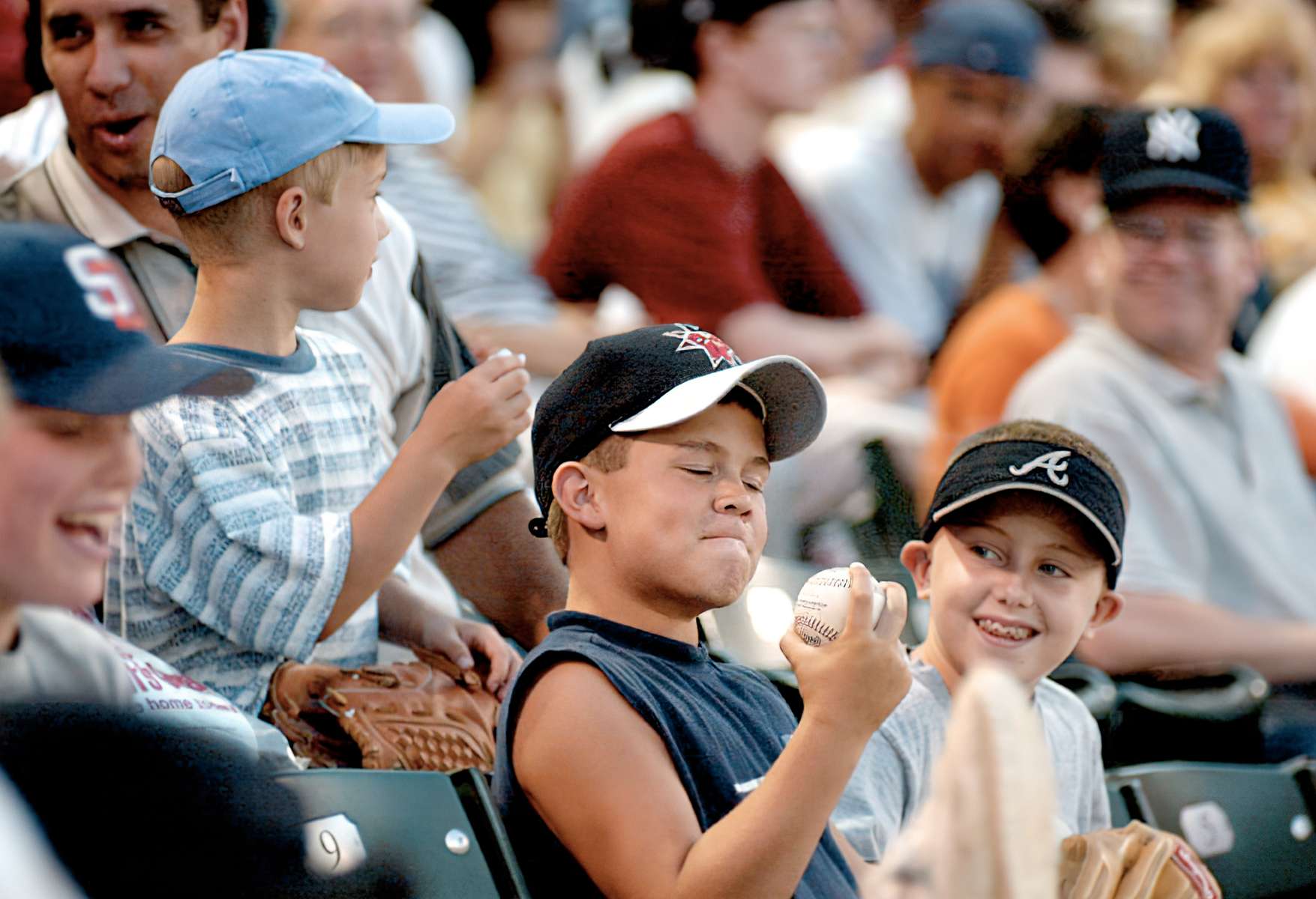Raymond Stallings (left), age 8, and his friend Mitchell Barnhill, age 9, (right) admire a baseball he caught over the first base line at Victory Field during a game between the Indianapolis Indians and the Norfolk Tides.   (staff photo/Karen Ducey. #60115. 6/25/01)