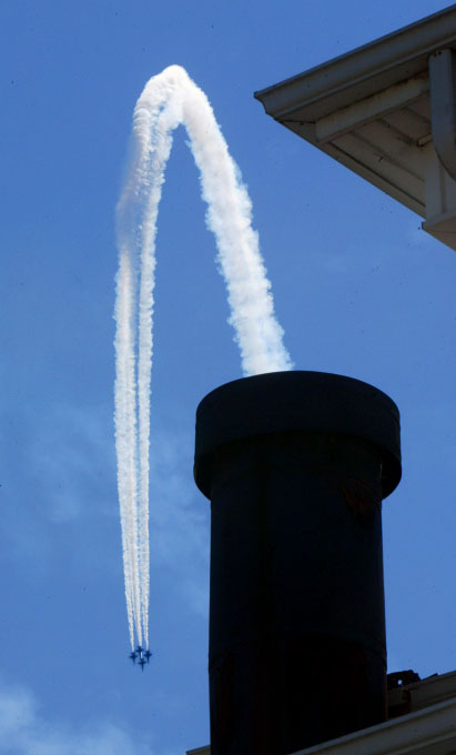 The Blue Angels appear to be flying out of the chimney of the Ebenezer A.M.E. Zion Church in the Central District. (PI photo/Karen Ducey)