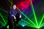 Laser light artist, John Borcherding, poses for a portrait at the Pacific Science Center. (© copyright Karen Ducey)