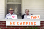 A couple offers $5 parking spaces in their yard outside the Indianapolis 500. (© copyright Karen Ducey)