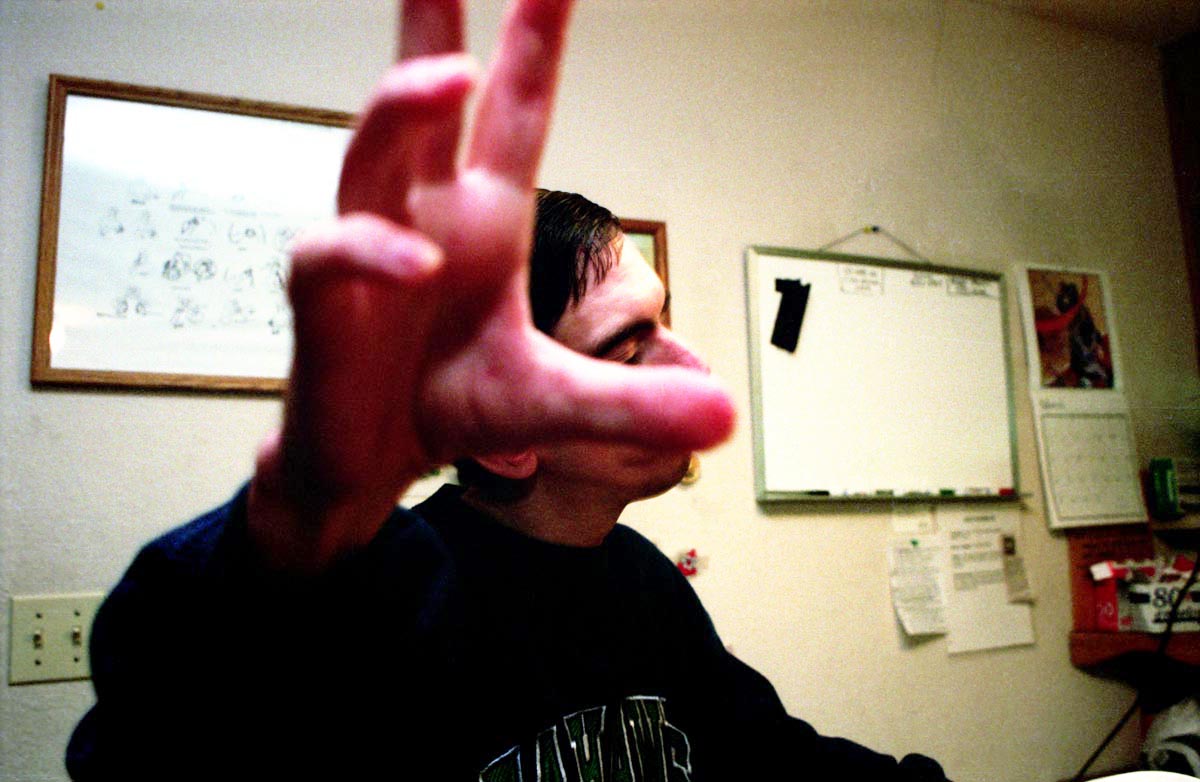 David reaches, perhaps as a way of seeing with his hands.  David Pyle was born both deaf and blind. Considered {quote}uneducatable{quote} by his pre school teachers, David never learned a formal sign language. Today, at age 32, David is considered developmentally disabled. He uses minimal gestures to communicate. (© copyright Karen Ducey)