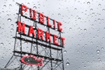 Pike Place Market sign seen through a windshield on a  rainy day in Seattle on Wednesday, January 31, 2024. 226055