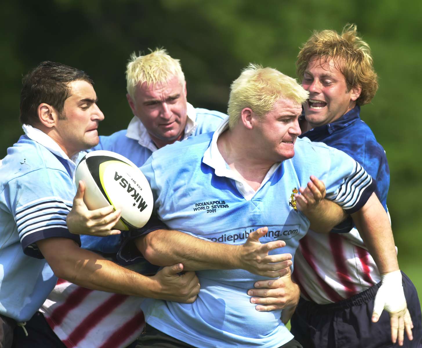 GENERAL INFORMATION: staff photo/Karen Ducey. #60062. 6/13/01IN THIS PHOTO: Matt Davies (center) from Rugby, England plays rugby against the New York City Fire department during the World Police and Fire Games.  He is a Prison Guard at Onley Prison in Great Britian.  {quote}The facilities are superb and the its all been organized excellent.{quote} he says of the games' experience.  {quote}Had a great night in Broad Ripple last night.  About the game he said {quote}Its been a bit tough... its too early in the morning.{quote}