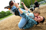 Vera Ranguelova plays on a swingset with her son Yoan, age 3, both from Lake City, WA in Laurelhurst on May 9, 2006. (PI photo/Karen Ducey)