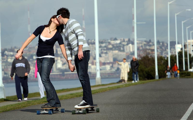 Angie Sherbina, 16, and her boyfriend Rod Lats,19, both from Federal Way, WAsh., skateboard along Alki Beach on Harbor Ave. and Alki Ave. SW on Valentines Day on February 14, 2008.  {quote}After this I'm going to surprise her with something.{quote} said Rod {quote}and then take her out to dinner.{quote}  The couple spent the {quote}whole day hanging out together{quote}.  {quote}Being together on a sunny day is just great.{quote} said Rod. (Karen Ducey/Seattle Post-Intelligencer)