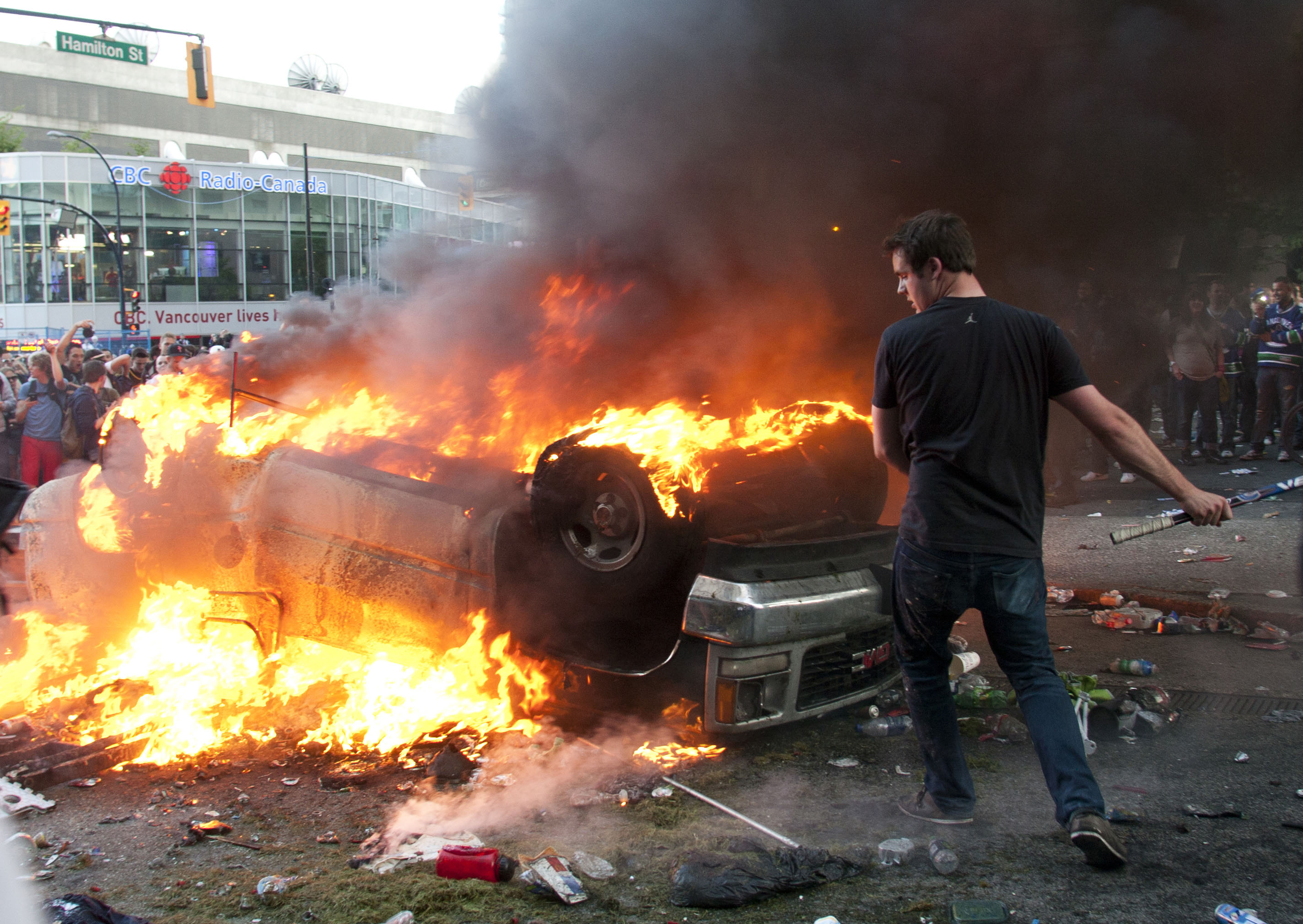 Rioters burn cars on the downtown streets of Vancouver,BC after the Canucks were defeated by the Boston Bruins in the Stanly Cup on June 15, 2011. (photo copyright Karen Ducey)