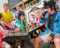 A group of friends in fancy dress drink outside the Sloop Inn in St Ives. May 2001
