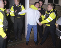 Humberside Police officers restrain a man suspected of causing a public order offence while under the influence of alcohol. April 2004