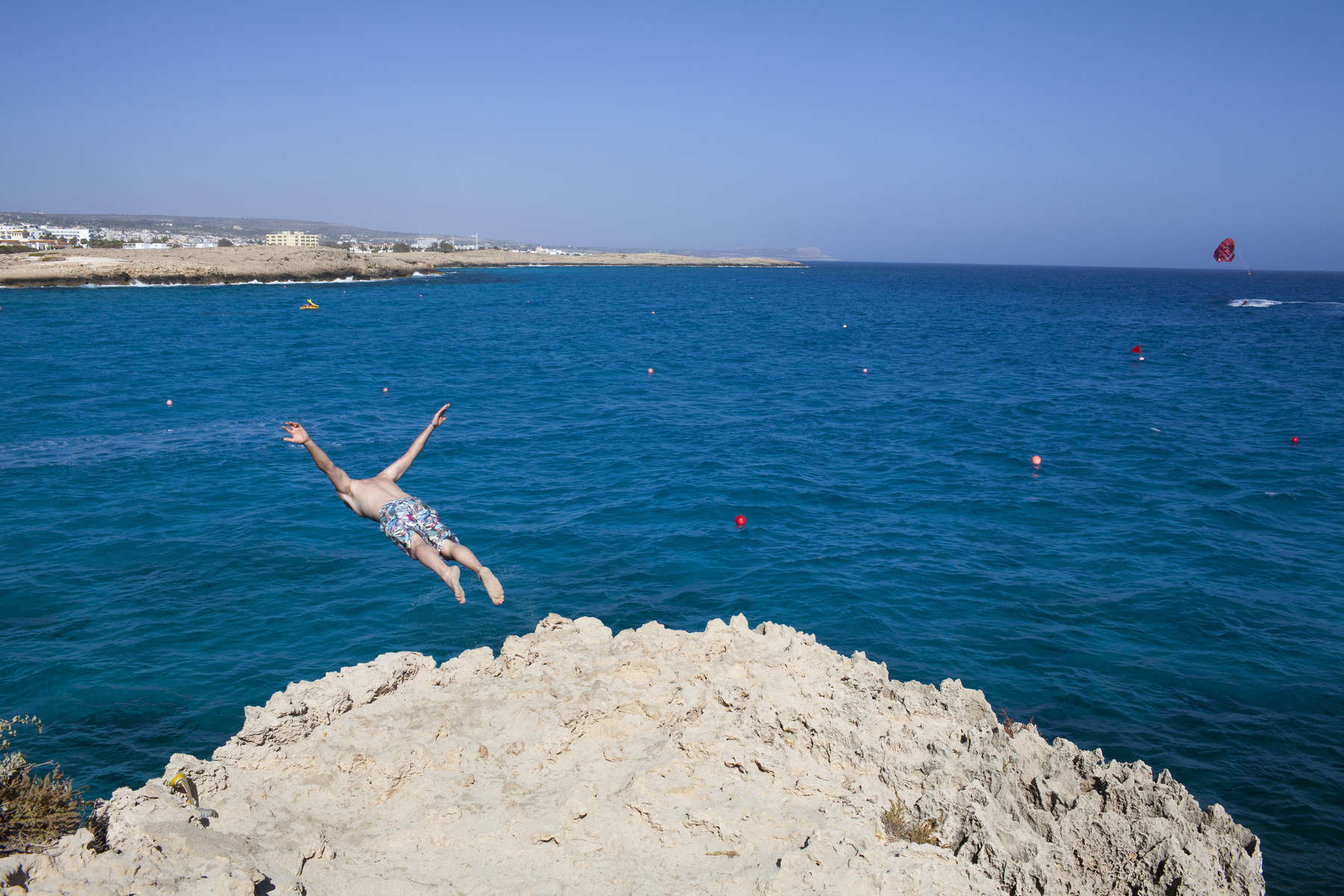 16:42 A British man swallow dives into the sea from a cliff near Nissi Beach, Ayia Napa, Cyprus.