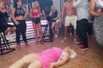 21: 43 Jody from Manchester, lies on the floor at Barcode bar during a game to celebrate her hen party in Ayia Napa, Cyprus. She is accompanied on the trip by around 30 of her friends and family.