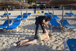 08:04 32 year old security officer George, tries to wake a British man found slumped on the beach in Magaluf, Majorca. George works a nine hour shift, seven days a week, five months a year. He patrols the beach alone, armed with only a baton and five years experience. At around 06:30 each morning, George starts to clear the beach of people who have chosen to sleep there or who have collapsed on it.