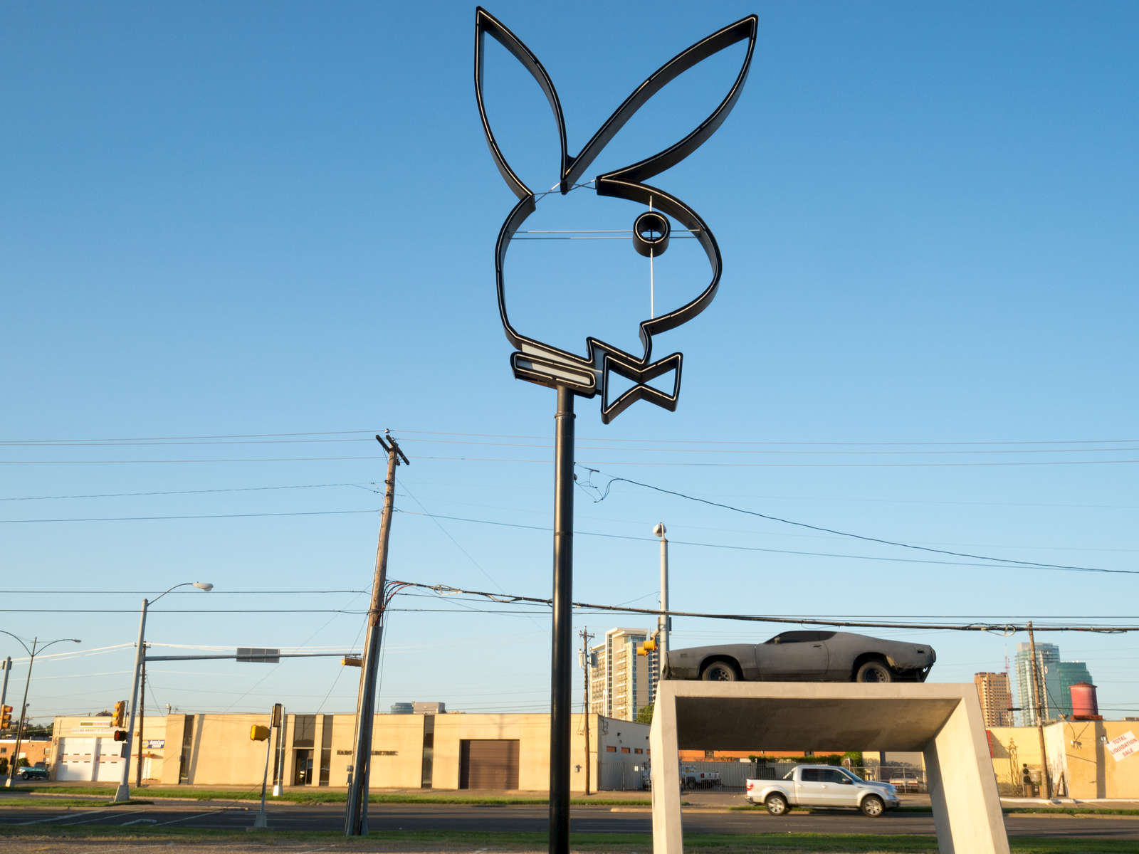 A Playboy Bunny sign in a derelict plot off Market Center Boulevard in Dallas.Dallas is a major city in Texas and is the largest urban center of the fourth most populous metropolitan area in the United States. The city ranks ninth in the U.S. and third in Texas after Houston and San Antonio. The city's prominence arose from its historical importance as a center for the oil and cotton industries, and its position along numerous railroad lines.For two weeks in the summer of 2015, photographer Peter Dench visited Dallas to document the metroplex in his epic reportage, DENCH DOES DALLAS.Photographed using an Olympus E-M5 Mark II©Peter Dench/Getty Images Reportage