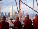 Buddhist Monks take in the view from the top of the Reunion Tower across the Dallas skyline dominated by the bulding of Bank of America.Dallas is a major city in Texas and is the largest urban center of the fourth most populous metropolitan area in the United States. The city ranks ninth in the U.S. and third in Texas after Houston and San Antonio. The city's prominence arose from its historical importance as a center for the oil and cotton industries, and its position along numerous railroad lines.For two weeks in the summer of 2015, photographer Peter Dench visited Dallas to document the metroplex in his epic reportage, DENCH DOES DALLAS.Photographed using an Olympus E-M5 Mark II©Peter Dench/Getty Images Reportage