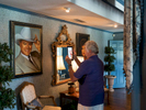 A visitor to the Southfork ranch takes a photograph of a painting of J. R. Ewing, one of the main characters from the TV show, Dallas, that aired from April 2, 1978, to May 3, 1991, on CBS. The series revolves around a wealthy and feuding Texan family, the Ewings, who own the independent oil company Ewing Oil and the cattle-ranching land of Southfork.Dallas is a major city in Texas and is the largest urban center of the fourth most populous metropolitan area in the United States. The city ranks ninth in the U.S. and third in Texas after Houston and San Antonio. The city's prominence arose from its historical importance as a center for the oil and cotton industries, and its position along numerous railroad lines.For two weeks in the summer of 2015, photographer Peter Dench visited Dallas to document the metroplex in his epic reportage, DENCH DOES DALLAS.Photographed using an Olympus E-M5 Mark II©Peter Dench/Getty Images Reportage