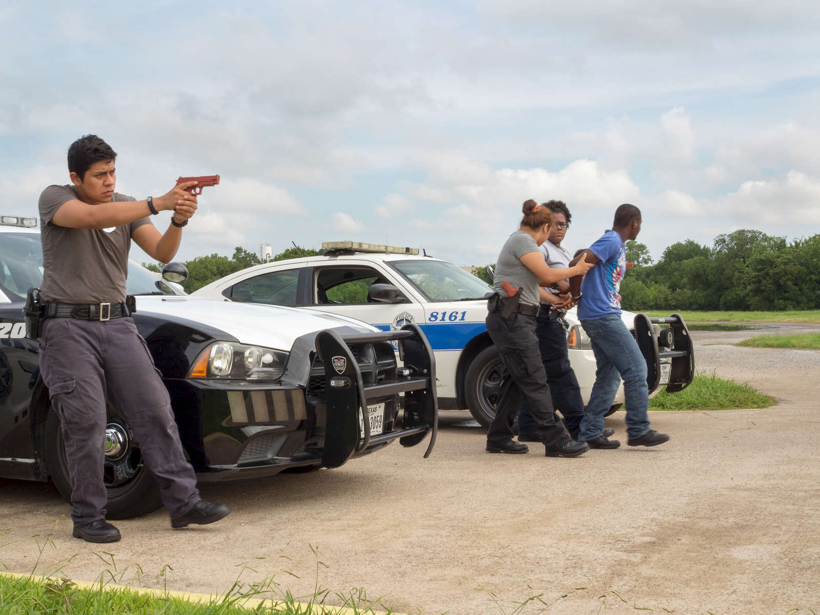 A demonstration of a Felony Traffic Stop by  Dallas Police Explorers [DPE]. The DPE program is designed to acquaint young people with the nature and complexity of law enforcement.Dallas is a major city in Texas and is the largest urban center of the fourth most populous metropolitan area in the United States. The city ranks ninth in the U.S. and third in Texas after Houston and San Antonio. The city's prominence arose from its historical importance as a center for the oil and cotton industries, and its position along numerous railroad lines.For two weeks in the summer of 2015, photographer Peter Dench visited Dallas to document the metroplex in his epic reportage, DENCH DOES DALLAS.Photographed using an Olympus E-M5 Mark II©Peter Dench/Getty Images Reportage