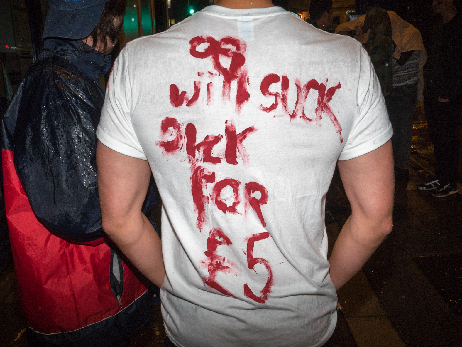 '.. will suck dick for £5' a message on the back of a T-shirt worn by a University of Bristol student on a night out during Freshers week.The University of Bristol is a red brick research university located in Bristol, United Kingdom. It received its royal charter in 1909, and its predecessor institution, University College, Bristol, had been in existence since 1876Freshers are inducted during Freshers' Week - the first week of the Academic year - ran by the Students' Union of that University, and is usually one of the busiest and most fun weeks of the year. ©Peter Dench/Getty Images Reportage