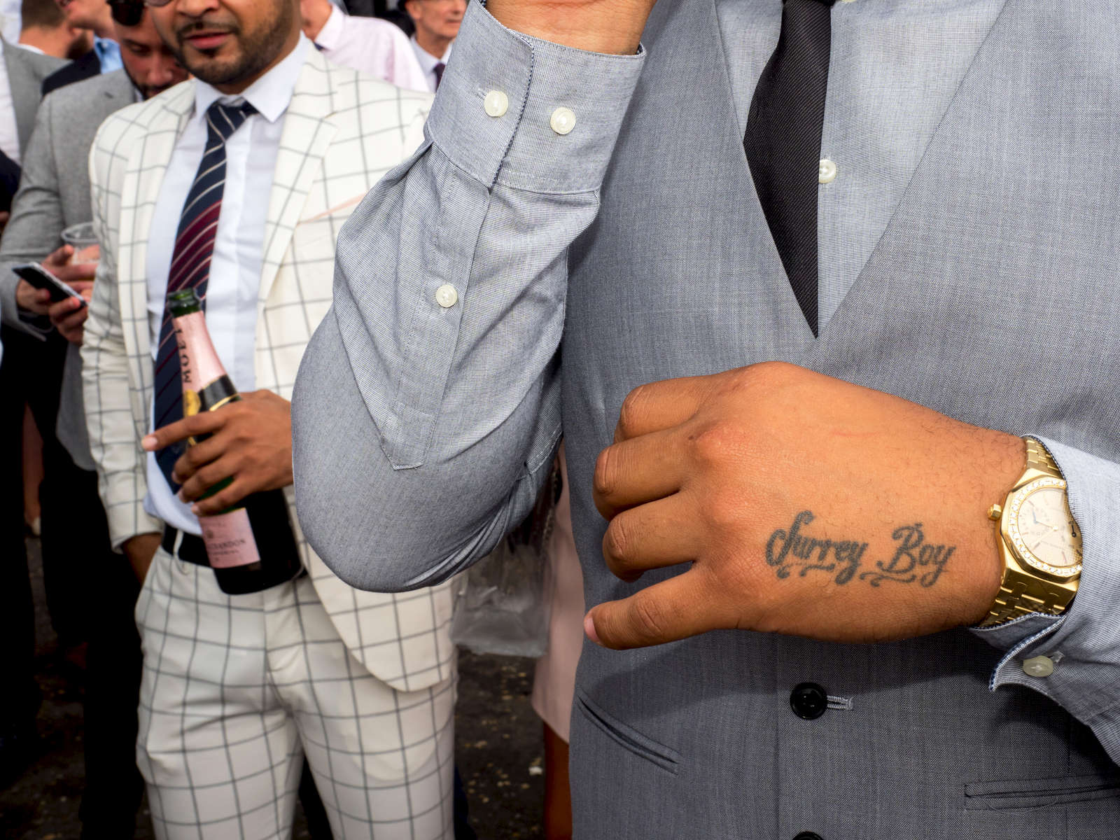 Surrey Boy; a tattoo of allegianc to the county by one male visitor to Epsom.Ladies' Day is traditionally held on the first Friday of June, a multitude of ladies and gents head to Epsom Downs Racecourse to experience a day full of high octane racing, music, glamour and fashion.