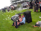 Visitor to Epsom take evasive action during a downpour.Ladies' Day is traditionally held on the first Friday of June, a multitude of ladies and gents head to Epsom Downs Racecourse to experience a day full of high octane racing, music, glamour and fashion.
