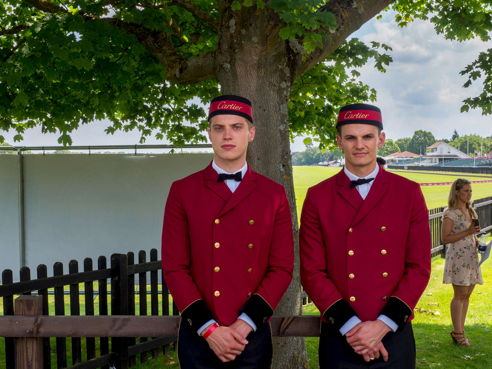 Cartier employees wait to open car doors for visitors to the prestigious VIP marquee.The 2017 Cartier Queen's Cup Final was played at the Guards Polo Club located in Windsor Great Park.