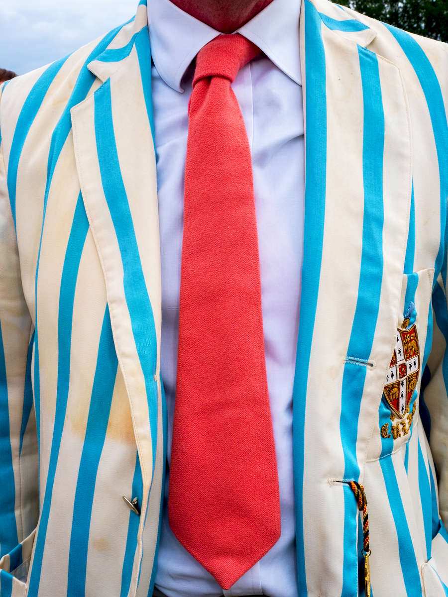 A man wearing a Leander Club tie and Cambridge University Lightweight Rowing Club blazer at the Henley Royal Regatta, a rowing event held annually on the River Thames by the town of Henley-on-Thames, England. It was established on 26 March 1839.
