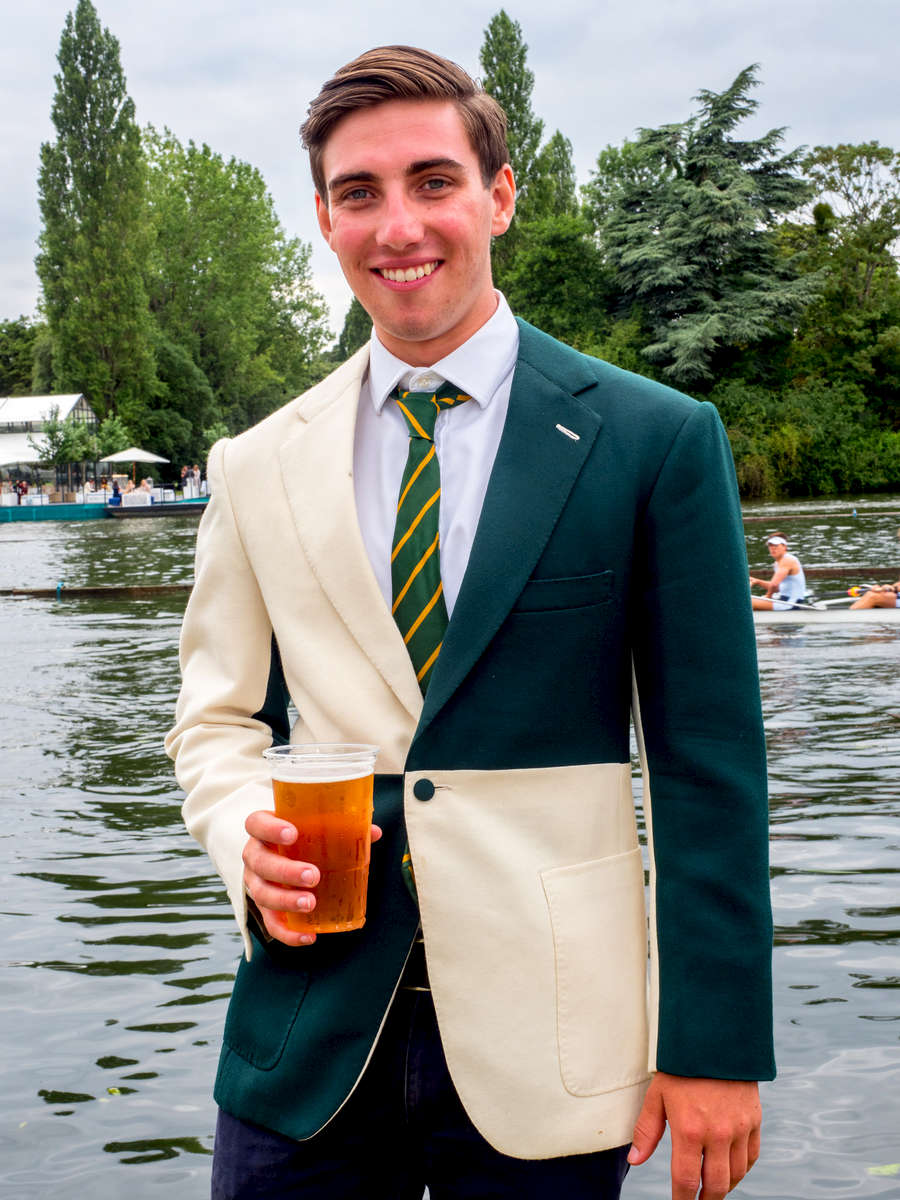 Miles Watson wears a jacket with the colours of Bewl Bridge Rowing Club. It is one of only two that exist and was presented to Watson on his 21st birthday for services to the club.Henley Royal Regatta is a rowing event held annually on the River Thames by the town of Henley-on-Thames, England. It was established on 26 March 1839.