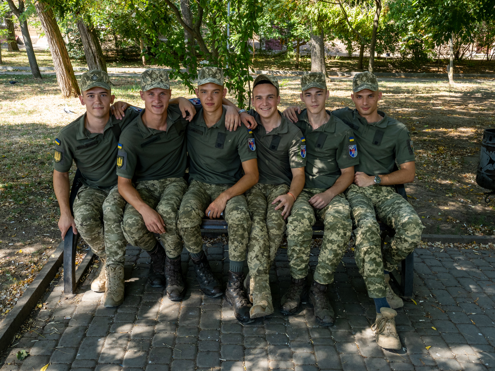 ODESSA, UKRAINE - AUGUST 28: Military Cadets relax in a park during a break from training in Odessa on August 28, 2023 in Odessa, Ukraine. The Odessa Military Academy is a modern higher military institution of the inter-services Armed Forces of Ukraine. It is one of the oldest military academies in the former Russian Empire, having been active for more than a century. (Photo by Peter Dench/Getty Images)