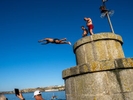 NEWQUAY, ENGLAND - AUGUST, 2022: During a heatwave in England, thousands of visitors headed to the town of Newquay, Cornwall for the surfing, beaches and Boardmasters Festival. Resources during the summer are stretched and some local residents are being pushed out of the area by tourists and due to an influx of holiday homes.