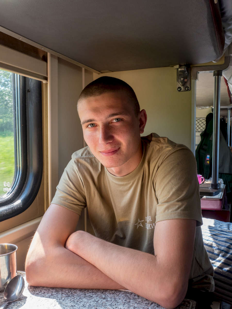 A young soldier sat in third class on the Trans-Siberian Railway from Moscow-Vladivostok. Spanning a length of 9,289km, it's the longest uninterrupted single country train journey in the world. It has connected Moscow with Vladivostok since 1916, and is still being expanded. It was built between 1891 and 1916 under the supervision of Russian government ministers personally appointed by Tsar Alexander III and his son, the Tsarevich Nicholas (later Tsar Nicholas II).