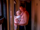 A father feels the heat with his baby on the Trans-Siberian Railway from Moscow-Vladivostok. Spanning a length of 9,289km, it's the longest uninterrupted single country train journey in the world. It has connected Moscow with Vladivostok since 1916, and is still being expanded. It was built between 1891 and 1916 under the supervision of Russian government ministers personally appointed by Tsar Alexander III and his son, the Tsarevich Nicholas (later Tsar Nicholas II).