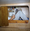 The room the crew sleeps in is a porthole less, fetid little cell - like a Scarborough caravan which has been wet and fishy for 20 years and used as a changing room for the local rugby team.  Fag stained plastic, wood grain-effect, laminated chipboard, vinyl and foam.  A tiny wet room below the water line and next to the ships engine. Tim tries to make his bunk more comforting with pictures of his family and reading the local news.In 1999, Photojournalist Peter Dench spent five days onboard The Allegiance, a 60 foot UK Scarborough-based trawler, fishing the North Sea, with a crew of five.  The future has since become extremely bleak for the English trawler men; huge areas of the North Sea have been declared \'off limits\' and fishing quotas have been slashed in an attempt to rescue dwindling North Sea stocks from the point of extinction.  These measures have jeopardised the jobs of those in the industry and put dependent towns, like Scarborough, on the brink of ruin.Dench returned to The Allegiance in 2005 to be reunited with the crew and to find out how the decline of the North Sea fishing industry has affected their lives.