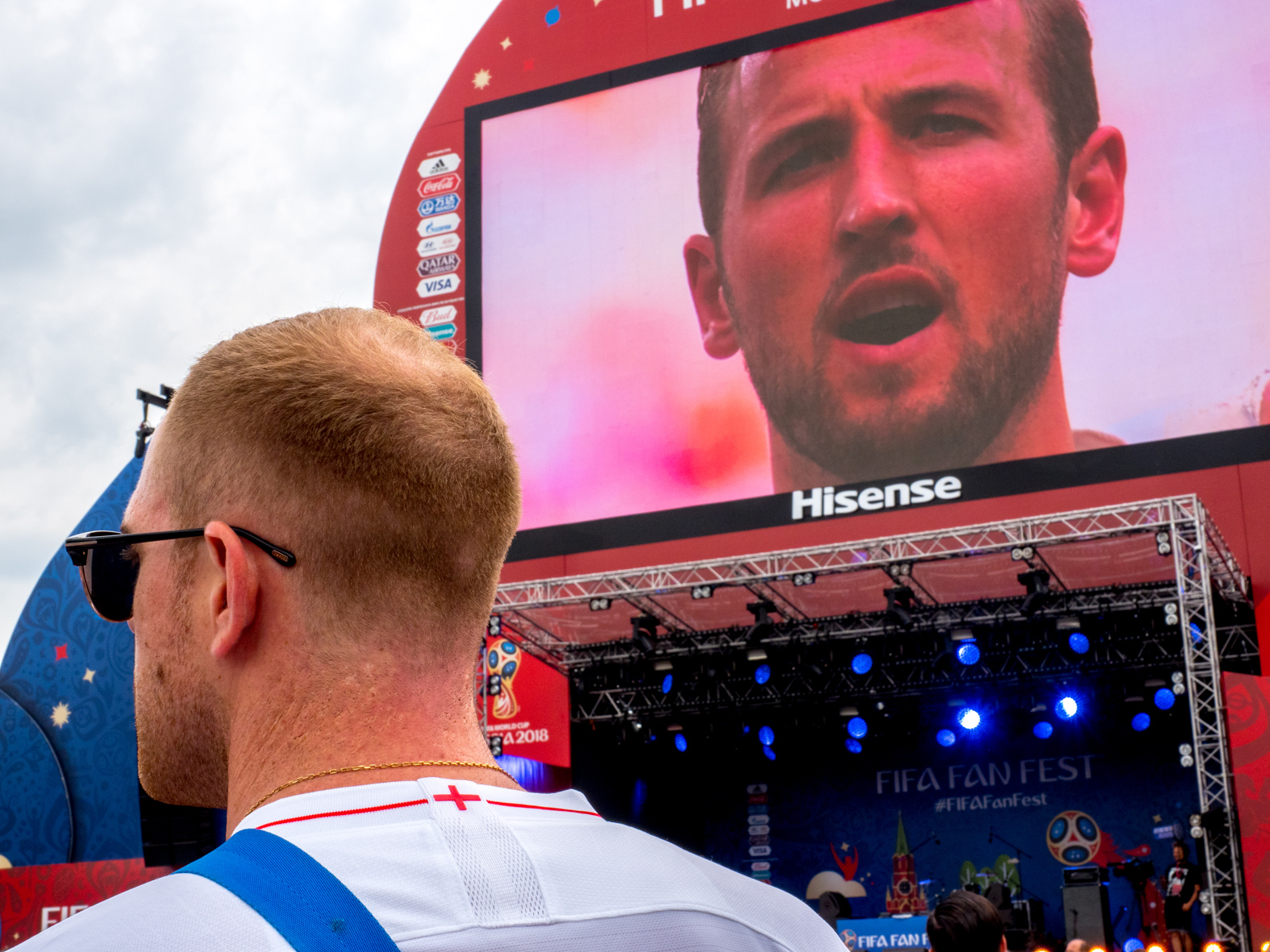 England captain, Harry Kane, featured singing the English national anthem on a big screen at FIFA Fan Fest.  The Moscow FIFA Fan Fest located at Vorobyovy Gory (Sparrow Hills) with a venue Capacity of 25,000. The site provides a spectacular view down the hill, directly towards Luzhniki Stadium and Moscow City. The 21st FIFA World Cup football tournament took place in Russia in 2018. It was the first World Cup to be held in Eastern Europe and the eleventh time that it has been held in Europe. For the first time the tournament took place on two continents – Europe and Asia. All but two of the stadium venues were in European Russia.