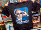 A souvenir T-Shirt of Vladimir Vladimirovich Putin, Russian statesman and former intelligence officer serving as President of Russia since 2012, previously holding the position from 2000 until 2008.The 21st FIFA World Cup football tournament took place in Russia in 2018. It was the first World Cup to be held in Eastern Europe and the eleventh time that it has been held in Europe. For the first time the tournament took place on two continents – Europe and Asia. All but two of the stadium venues were in European Russia.