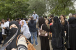 Arab women listen to the various public speaking at Speakers Corner in Hyde Park London.Arabs have been visiting London for centuries and around 300,000 Arabs have chosen to make the capital their home and a further half a million throughout the UK. The number swells significantly from visitors during the summer. Saudi Arabians spend the most on property in London choosing Belgravia, Kenington, Knightsbridge and Holland Park. Arab culture continues to increase in visibility throughout the capital as integration into this most transient of city's continues.©Peter Dench/Reportage by Getty Images