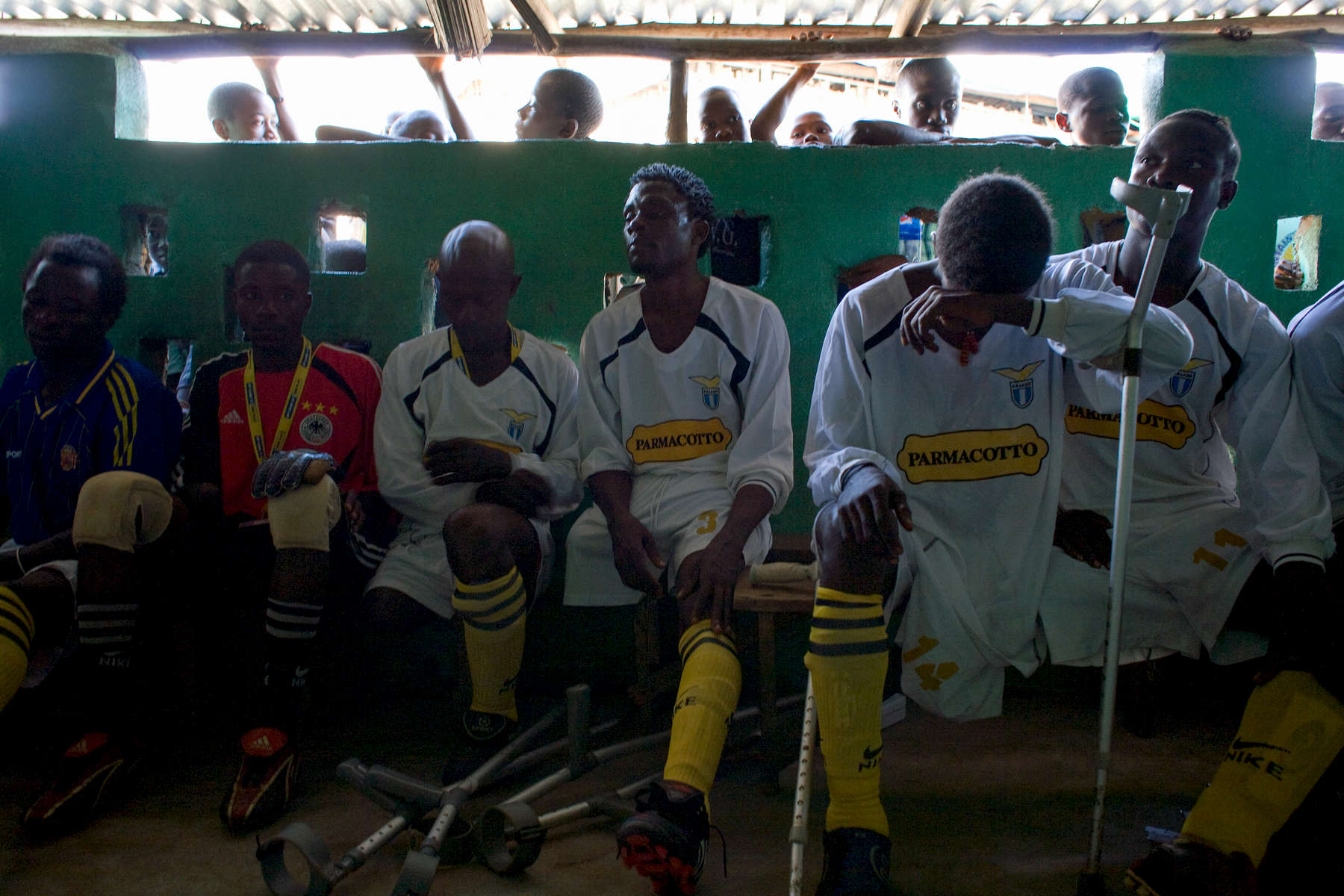 Players from LASA, the Liberia Amputee Sports Association football team say a prayer before a match. Almost all of the players are victims of the genocidal war that wrecked the nation. Players who used to fight each other now play on the same side. In disaster areas, war zones and urban wastelands, football keeps humanity alive. It brings nations together and promotes unity. It encourages equality and generates pride and self-belief. It has the power to heal and to help, to motivate, to give freedom to dreams and empower a generation. There are millions of people playing the game or helping it to flourish who find that football brings a positive dimension to their lives.Away from the billionaire owned clubs with it's multi-million dollar players, Football's Hidden Story is a series of emotive human interest photographs showing the positive impact football has had at grassroot level on individuals and communities all around the world. 