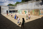 Brazilian kids play beach football at the EPROCAD centre in Sao Paulo. Football is used to transform chldren with low self esteem and negative perception into critical proactive citizens.In disaster areas, war zones and urban wastelands, football keeps humanity alive. It brings nations together and promotes unity. It encourages equality and generates pride and self-belief. It has the power to heal and to help, to motivate, to give freedom to dreams and empower a generation. There are millions of people playing the game or helping it to flourish who find that football brings a positive dimension to their lives.Away from the billionaire owned clubs with it's multi-million dollar players, Football's Hidden Story is a series of emotive human interest photographs showing the positive impact football has had at grassroot level on individuals and communities all around the world. 