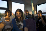 Laiba Abassi (2nd right) and Robyn Kullar (left) on the bus to The Beck Theatre where Laiba will perfom as Adriana and Robyn as Luciana in a production of William Shakespeare's 'Comedy of Errors' as part of the 10th Anniversary Shakespeare School Festival. Laiba (15) a Muslim and Robyn Kullar (15) a Sikh are very close friends and pupils at Villiers High School in Southall.Villiers High School is in the town of Southall. It has a very wide ethnic diversity. 45 different 1st spoken languages are listed among the 1208 pupils. 25 ethnic groups are represented with Indian, Pakistani and Black-Somali the three highest.Southall is a suburban district of West London, England. The town has one of the largest concentrations of South Asian people outside of the Indian sub-continent. Over 55% os Southall's population of 70,000 is Indian/Pakistani, with less than 10% being White British.