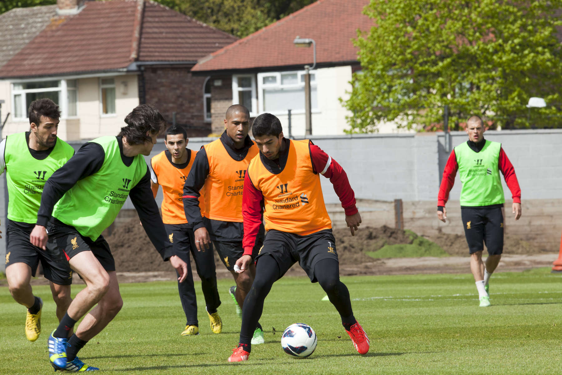 Liverpool FC striker Luis Suarez during training for the cllub at Melwood.Melwood is the Liverpool FC training ground, located in the West Derby area of Liverpool. It is seperate from the Liverpool Academy, which is based in Kirkby.Melwood was redeveloped in the early 2000′s with large input from then-manager Gerard Houllier and now features some of the best facilities in Europe. It has been the club’s training ground since the fifties and was previously transformed into a top class facility by Bill Shankly.Facilities include sythetic pitches, rehabilitation rooms, press and meeting rooms, gymnasium, swimming pool, restaurant and recreational facilities.